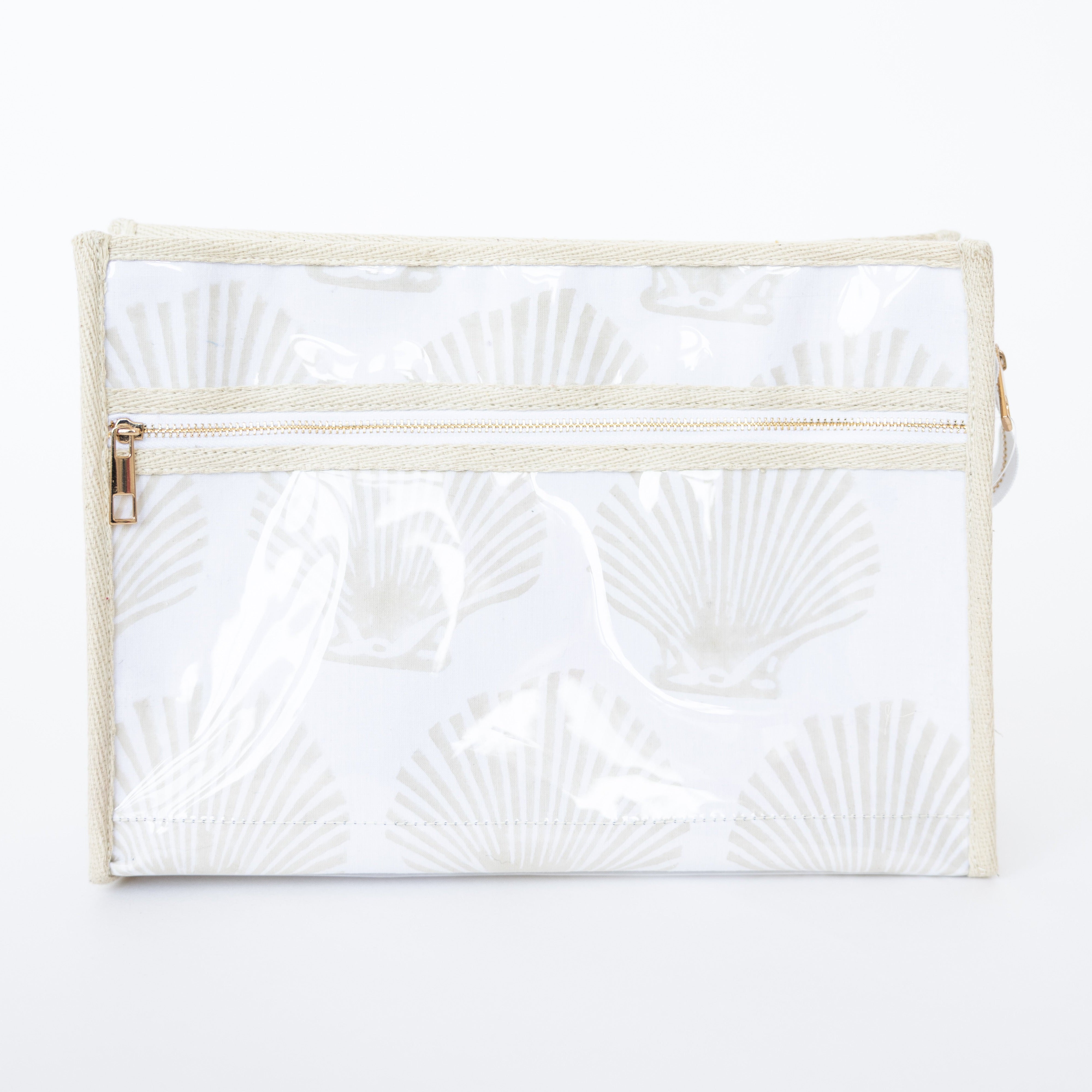 White pouch with shell pattern and gold zipper on a white background