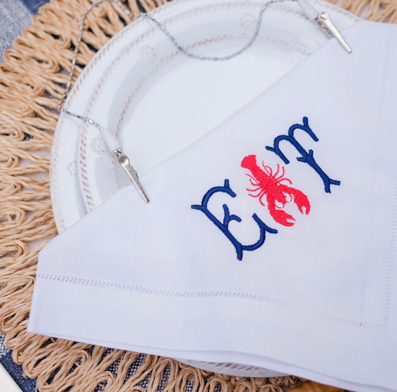 The Monogram Mary Lobster kit turns napkins into lobster bibs