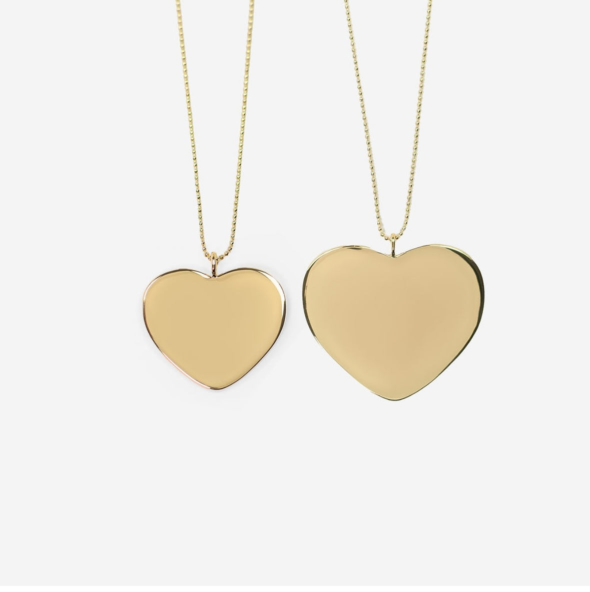 picture of both sizes of monogram Mary heart necklace